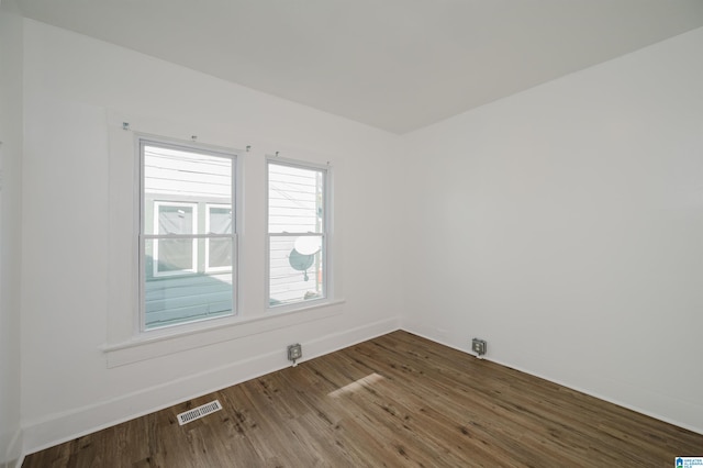 spare room with hardwood / wood-style flooring