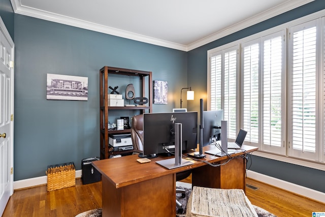 home office with ornamental molding, dark hardwood / wood-style floors, and a healthy amount of sunlight