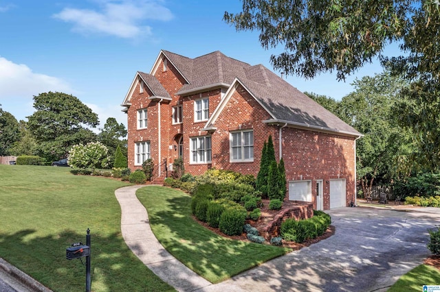 view of front facade with a front yard and a garage