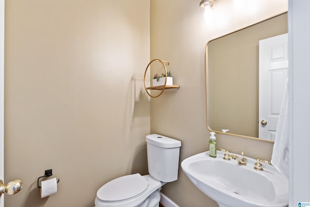 bathroom with sink and toilet