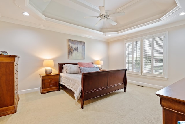 carpeted bedroom with crown molding, a raised ceiling, and ceiling fan