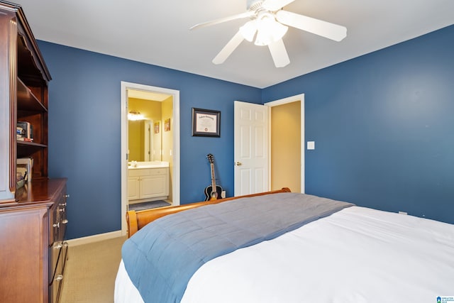 carpeted bedroom featuring connected bathroom and ceiling fan