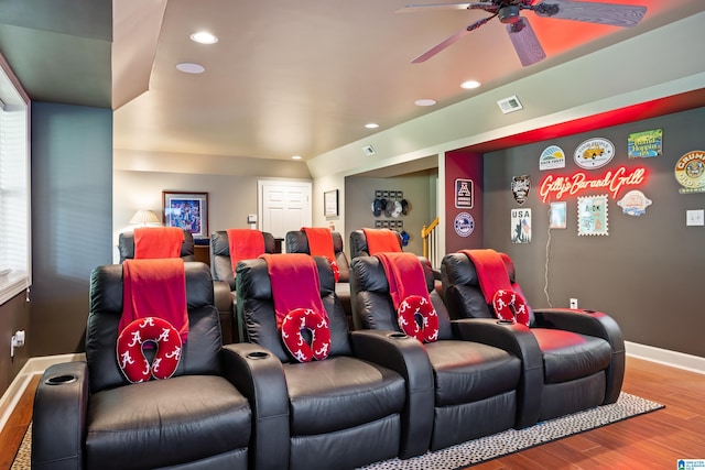 home theater with wood-type flooring and ceiling fan