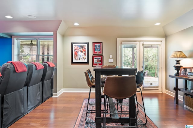 dining room with lofted ceiling and hardwood / wood-style floors