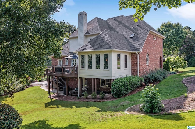 back of house featuring a wooden deck and a yard