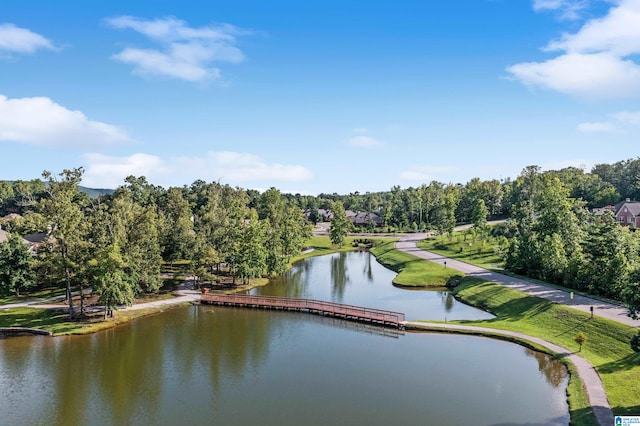 surrounding community featuring a water view