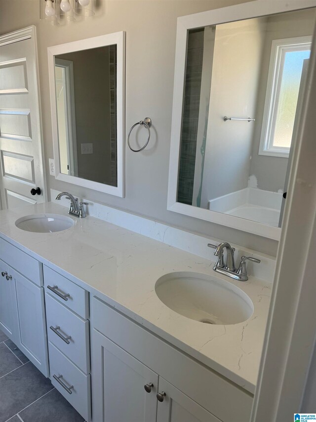 bathroom with vanity and tile patterned flooring