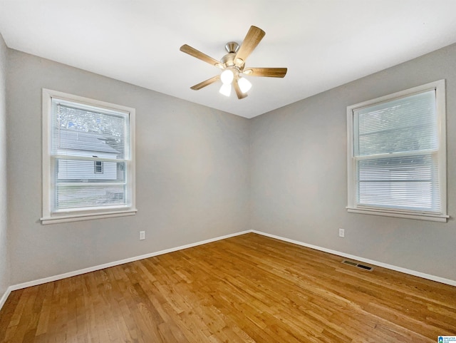 2400 2nd Ave N, Irondale, AL 35210 - spare room with visible vents, a ceiling fan, baseboards, and wood finished floors