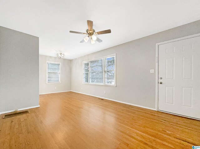 2400 2nd Ave N, Irondale, AL 35210 - interior space featuring baseboards, a ceiling fan, light wood-type flooring, and visible vents