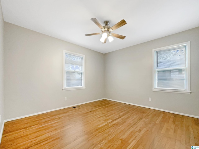 2400 2nd Ave N, Irondale, AL 35210 - spare room with baseboards, plenty of natural light, ceiling fan, and light wood-style floors