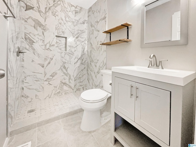 2400 2nd Ave N, Irondale, AL 35210 - bathroom with toilet, a shower stall, tile patterned flooring, and vanity