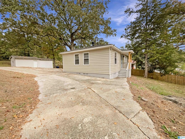 2400 2nd Ave N, Irondale, AL 35210 - view of front of home featuring fence, an outbuilding, crawl space, and concrete driveway