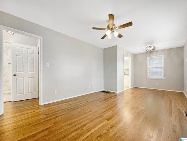 2400 2nd Ave N, Irondale, AL 35210 - empty room featuring baseboards, ceiling fan, wood finished floors, and visible vents