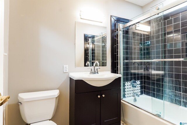 5268 Goldmar Dr, Irondale, AL 35210 - bathroom featuring toilet, shower / bath combination with glass door, and vanity