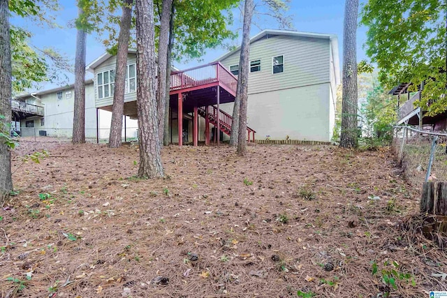 5268 Goldmar Dr, Irondale, AL 35210 - rear view of property with stairway, a wooden deck, and fence