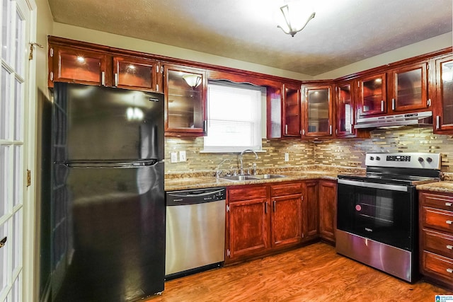 5268 Goldmar Dr, Irondale, AL 35210 - kitchen featuring appliances with stainless steel finishes, a sink, under cabinet range hood, and dark brown cabinets