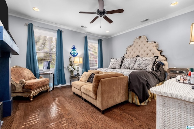 bedroom with ornamental molding, dark wood-type flooring, and ceiling fan