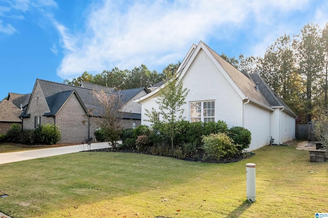 view of property exterior with a yard