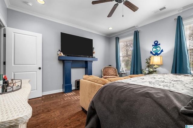 bedroom featuring dark hardwood / wood-style flooring, ornamental molding, and ceiling fan