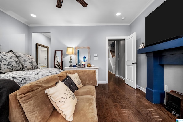 bedroom with ceiling fan, crown molding, dark hardwood / wood-style flooring, and heating unit