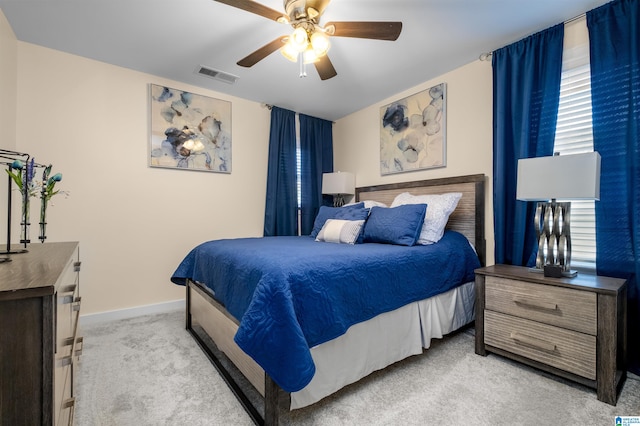 bedroom with ceiling fan and light colored carpet