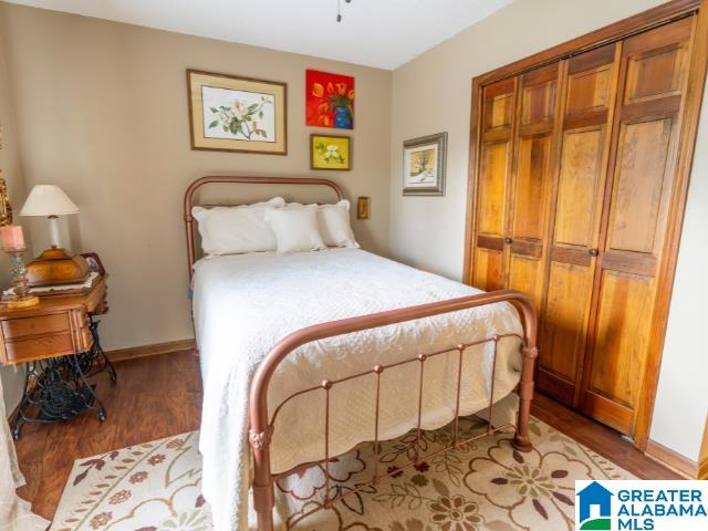 bedroom with light wood-type flooring and a closet