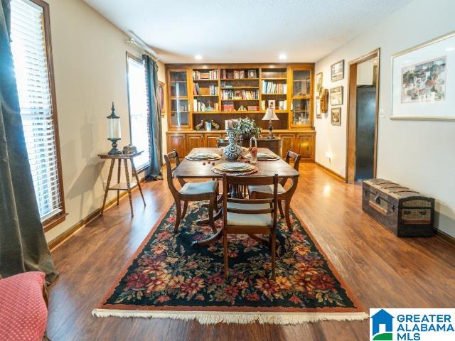 dining space with hardwood / wood-style floors