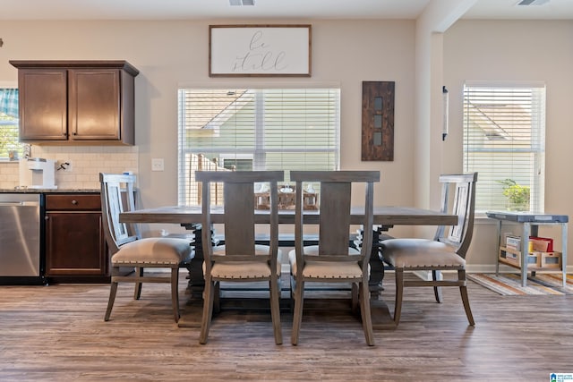 dining room featuring hardwood / wood-style floors and a wealth of natural light