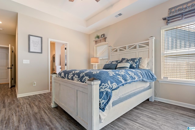 bedroom with dark wood-type flooring and ceiling fan