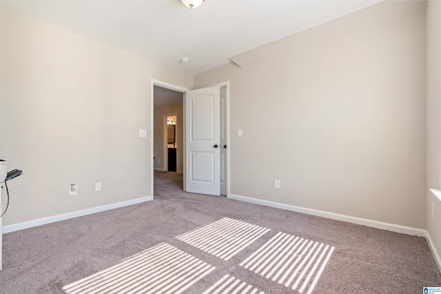 unfurnished bedroom with light colored carpet