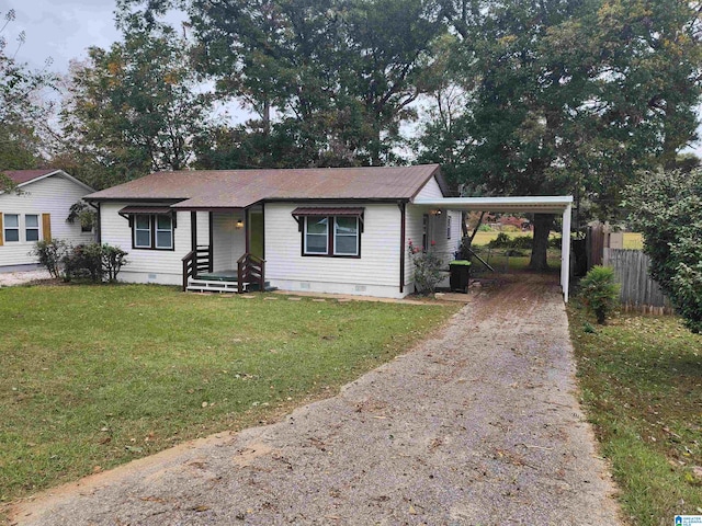 ranch-style home with a front lawn and a carport