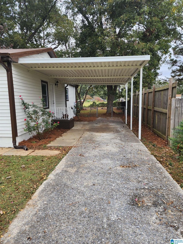 view of vehicle parking featuring a carport