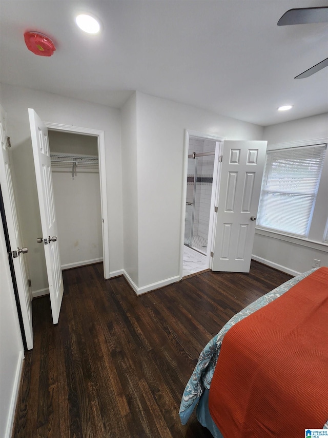 bedroom featuring dark hardwood / wood-style floors and a closet