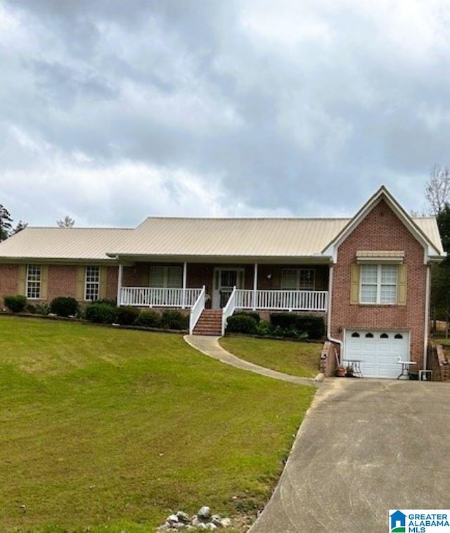 single story home featuring covered porch, a garage, and a front lawn