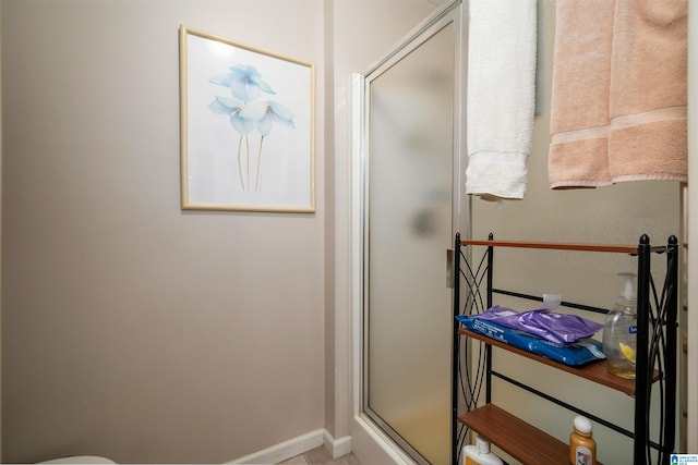 bathroom featuring an enclosed shower