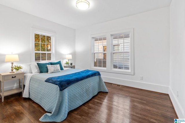 bedroom featuring dark hardwood / wood-style floors