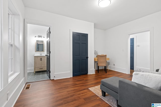 living room with sink and dark hardwood / wood-style flooring