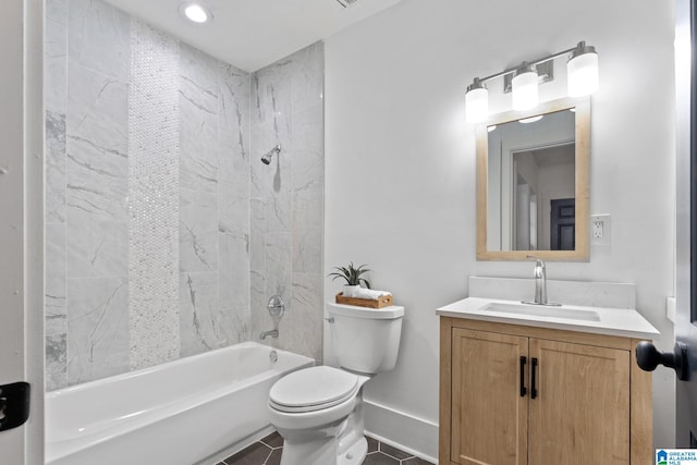 full bathroom with toilet, tiled shower / bath, vanity, and tile patterned floors