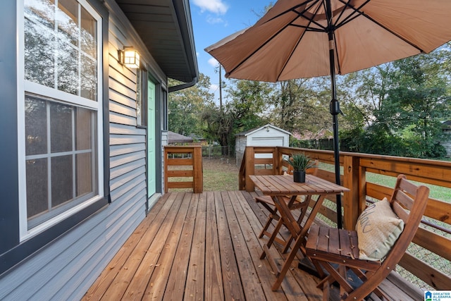 wooden deck with a shed