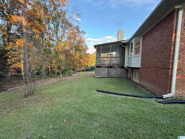 view of yard featuring a sunroom