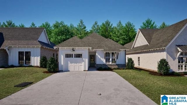 view of front facade with a front yard and a garage