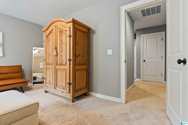 sitting room with light colored carpet