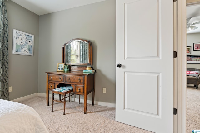 bedroom with light carpet and ceiling fan