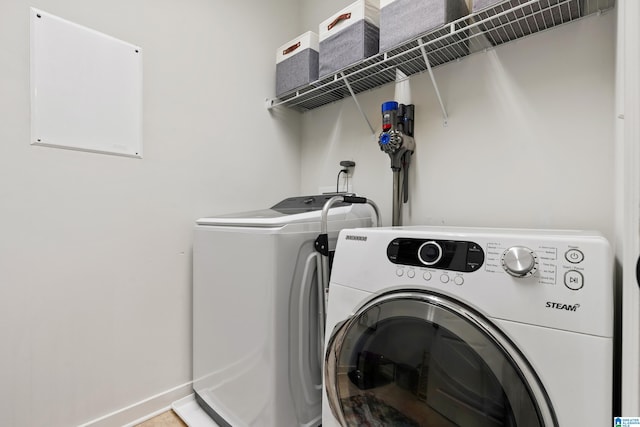 laundry room featuring washing machine and dryer