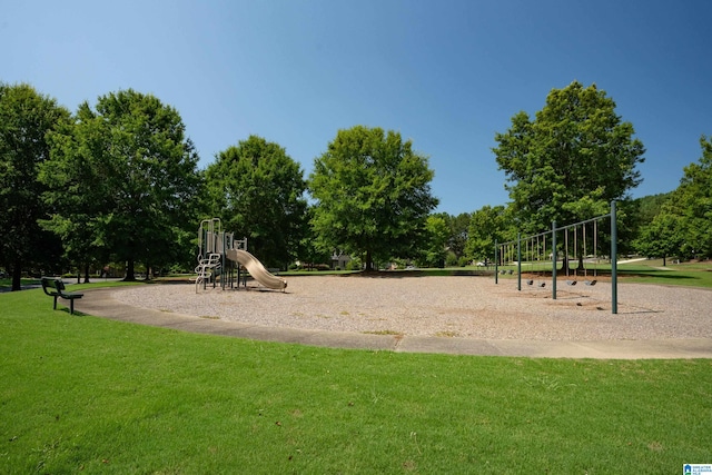 view of jungle gym featuring a lawn