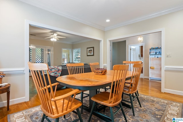 dining room featuring ornamental molding, hardwood / wood-style flooring, and ceiling fan