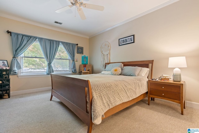 bedroom with light carpet, crown molding, and ceiling fan