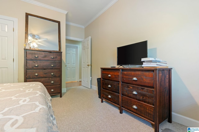 carpeted bedroom with crown molding and ceiling fan