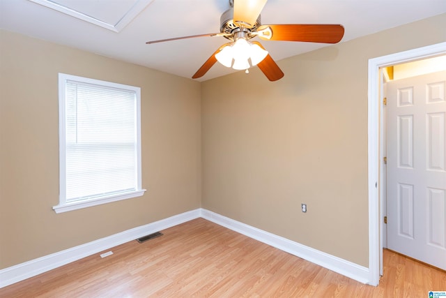 spare room with light hardwood / wood-style floors and ceiling fan