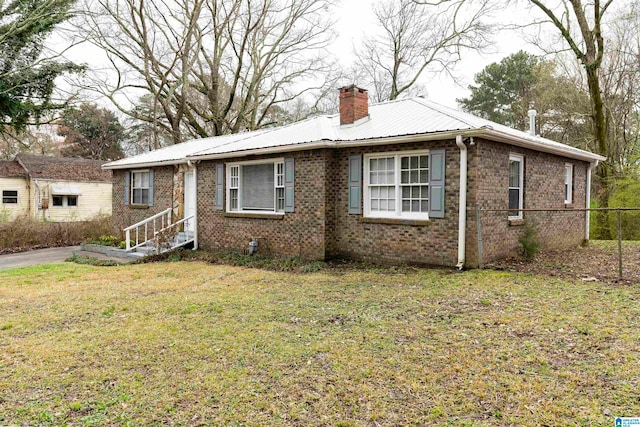 ranch-style home with a front lawn